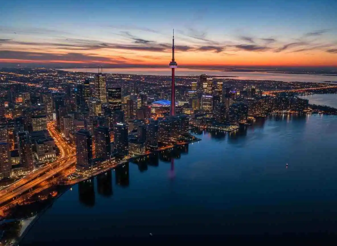 Toronto skyline at dusk with CN Tower and Lake Ontario, representing senior dating opportunities